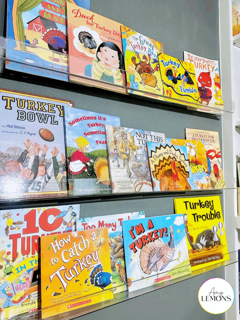 A book shelf with Turkey themed children's picture books for Thanksgiving reading
