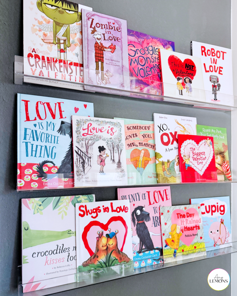 A row of clear shelves with Valentine's Day themed books