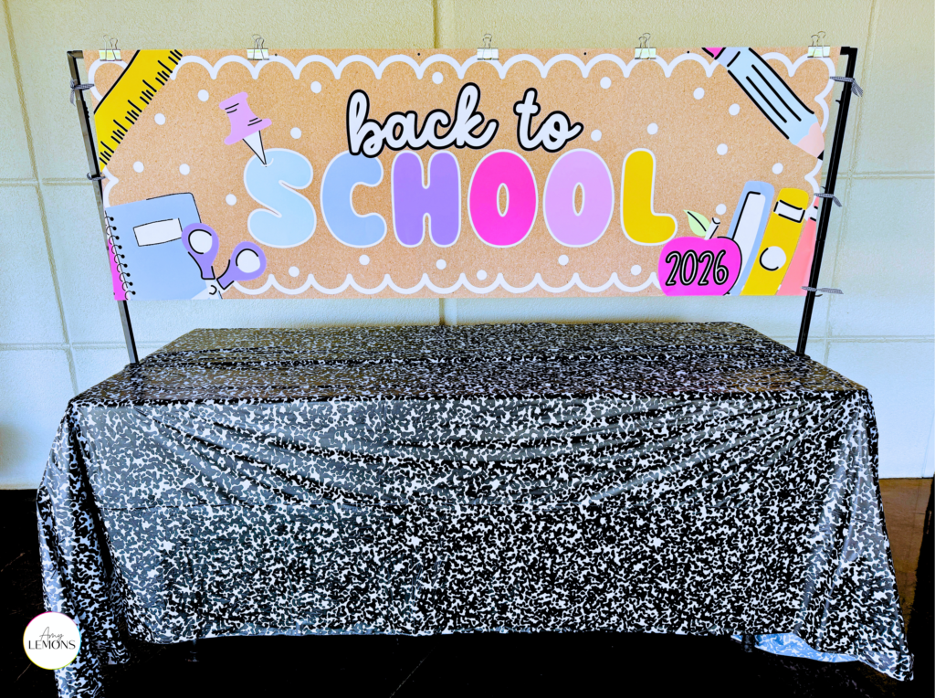 Free printable back to school banner centered on a first day of school photo backdrop
