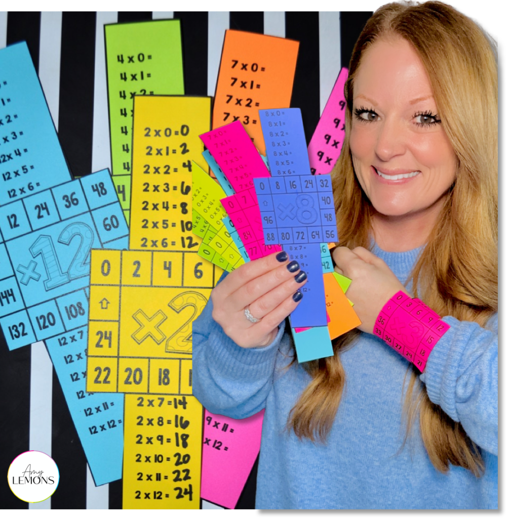 Amy Lemons holding printable multiplication fact bracelets on bright paper with one worn on her wrist